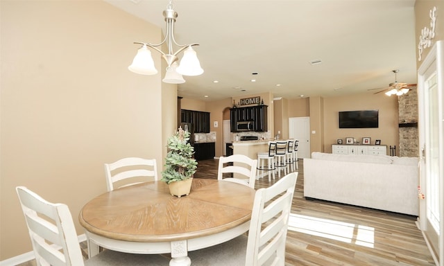 15727 W Chamfer Way, Crosby, TX 77532 - dining space with light wood-style flooring, ceiling fan, recessed lighting, and baseboards