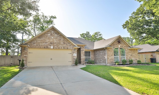 15727 W Chamfer Way, Crosby, TX 77532 - view of front of house with brick siding, an attached garage, concrete driveway, and roof with shingles