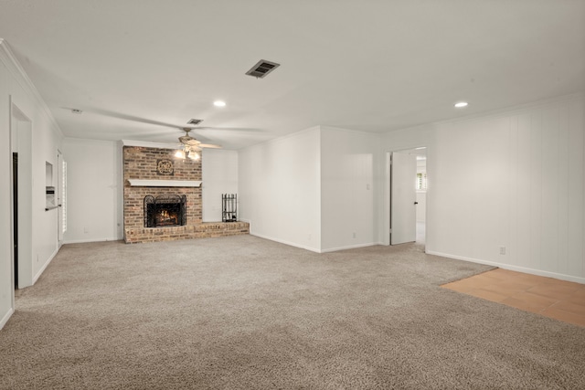 108 Hereford Dr, Conroe, TX 77304 - unfurnished living room with ceiling fan, ornamental molding, light colored carpet, a fireplace, and recessed lighting