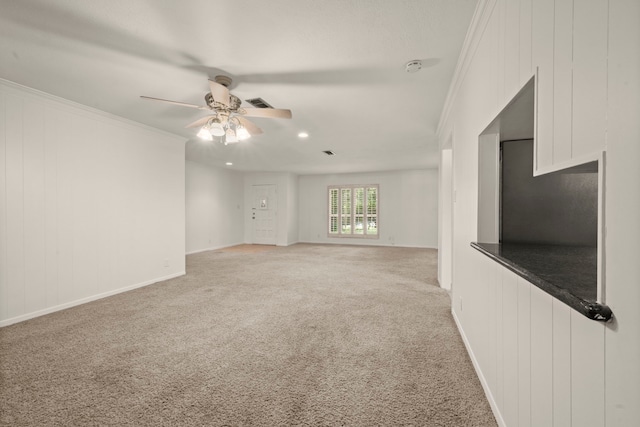 108 Hereford Dr, Conroe, TX 77304 - unfurnished living room with a ceiling fan, light colored carpet, ornamental molding, baseboards, and recessed lighting