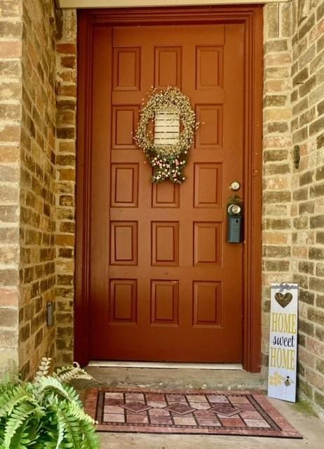 108 Hereford Dr, Conroe, TX 77304 - view of exterior entry featuring brick siding