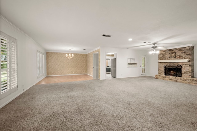 108 Hereford Dr, Conroe, TX 77304 - unfurnished living room featuring a brick fireplace, light colored carpet, a chandelier, ceiling fan, and baseboards