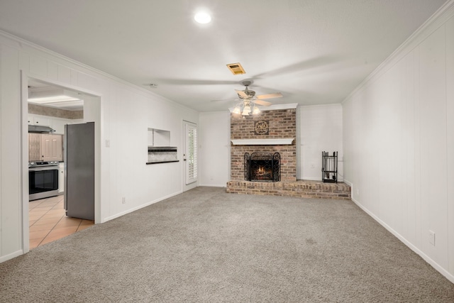 108 Hereford Dr, Conroe, TX 77304 - unfurnished living room featuring light colored carpet, crown molding, a ceiling fan, a fireplace, and baseboards