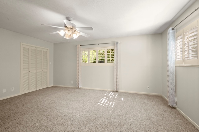 108 Hereford Dr, Conroe, TX 77304 - unfurnished bedroom with carpet, baseboards, a closet, and a ceiling fan