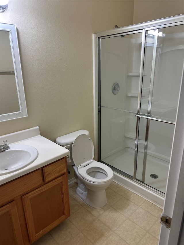 6410 Provident Green Dr, Katy, TX 77449 - full bath with vanity, a stall shower, toilet, and tile patterned floors