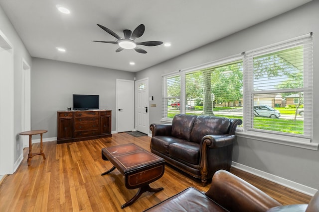 5202 Libbey Ln, Houston, TX 77092 - living room featuring a ceiling fan, light wood finished floors, baseboards, and recessed lighting