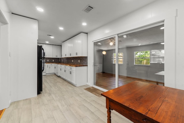 5202 Libbey Ln, Houston, TX 77092 - kitchen with white cabinets, decorative backsplash, recessed lighting, dark countertops, and a ceiling fan