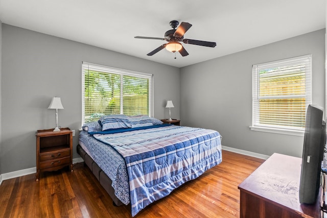 5202 Libbey Ln, Houston, TX 77092 - bedroom featuring wood finished floors, baseboards, and ceiling fan