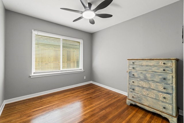 5202 Libbey Ln, Houston, TX 77092 - unfurnished bedroom featuring wood finished floors, baseboards, and a ceiling fan