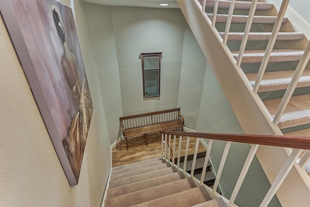 8800 Woodway Dr Unit 12, Houston, TX 77063 - staircase with wood finished floors, baseboards, and recessed lighting