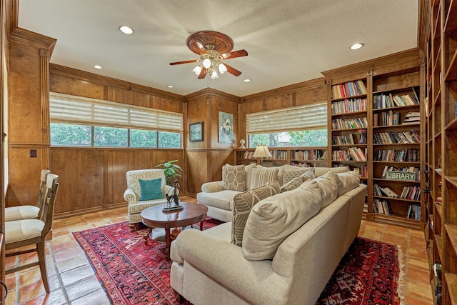 8800 Woodway Dr Unit 12, Houston, TX 77063 - living room featuring ceiling fan, wooden walls, and recessed lighting