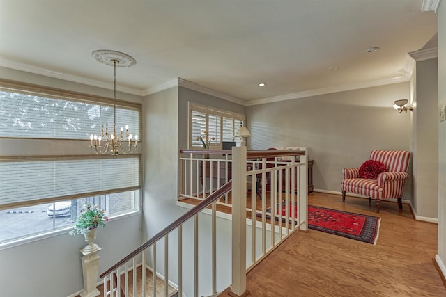 8800 Woodway Dr Unit 12, Houston, TX 77063 - corridor with an upstairs landing, wood finished floors, a chandelier, baseboards, and ornamental molding