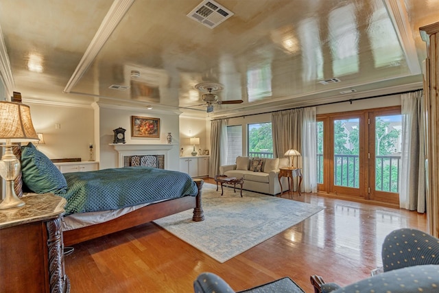 8800 Woodway Dr Unit 12, Houston, TX 77063 - bedroom with access to outside, ornamental molding, a fireplace, and wood finished floors