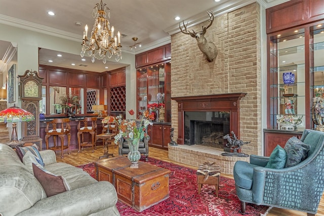 8800 Woodway Dr Unit 12, Houston, TX 77063 - living area featuring ornamental molding, wood finished floors, a chandelier, recessed lighting, and a brick fireplace