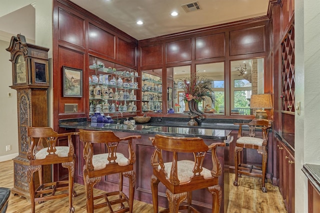 8800 Woodway Dr Unit 12, Houston, TX 77063 - indoor wet bar with light wood-style floors and recessed lighting