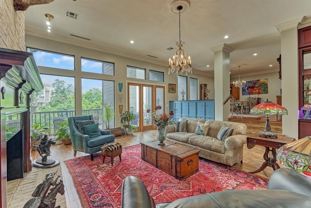 8800 Woodway Dr Unit 12, Houston, TX 77063 - living room with a chandelier, ornamental molding, a fireplace, light wood-type flooring, and recessed lighting
