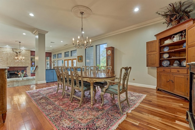 8800 Woodway Dr Unit 12, Houston, TX 77063 - dining room featuring a chandelier, baseboards, light wood-style flooring, crown molding, and recessed lighting