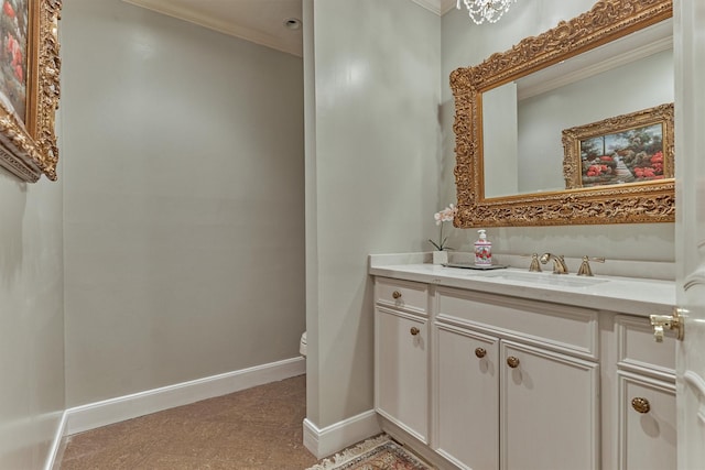 8800 Woodway Dr Unit 12, Houston, TX 77063 - bathroom featuring toilet, crown molding, vanity, and baseboards