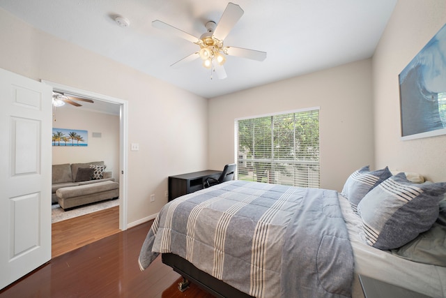 1330 Old Spanish Trl Unit 5203, Houston, TX 77054 - bedroom featuring wood finished floors, a ceiling fan, and baseboards