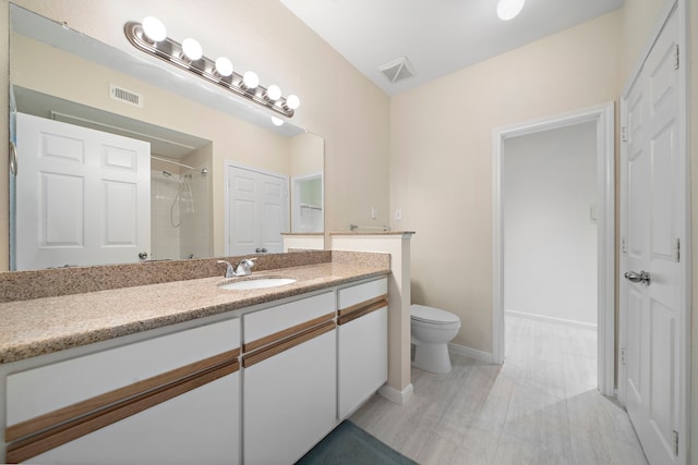 1330 Old Spanish Trl Unit 5203, Houston, TX 77054 - bathroom featuring vanity, toilet, a shower, and baseboards