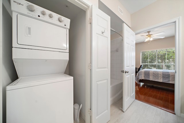 1330 Old Spanish Trl Unit 5203, Houston, TX 77054 - laundry room featuring stacked washing machine and dryer and ceiling fan