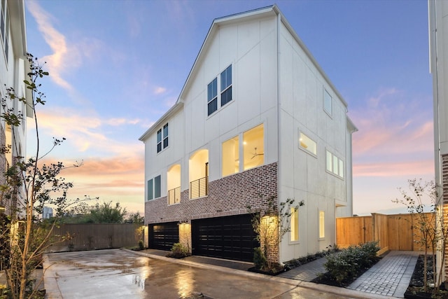 3049 Hicks St, Houston, TX 77007 - view of front of house featuring an attached garage, concrete driveway, and brick siding