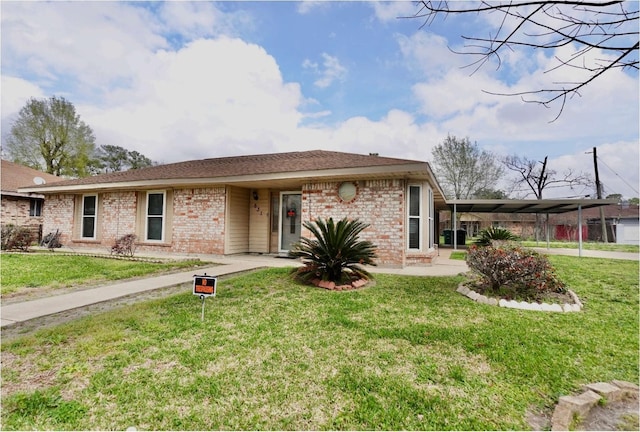 631 Soft Shadows Ln, Houston, TX 77013 - view of front of property featuring brick siding, a front yard, and a carport