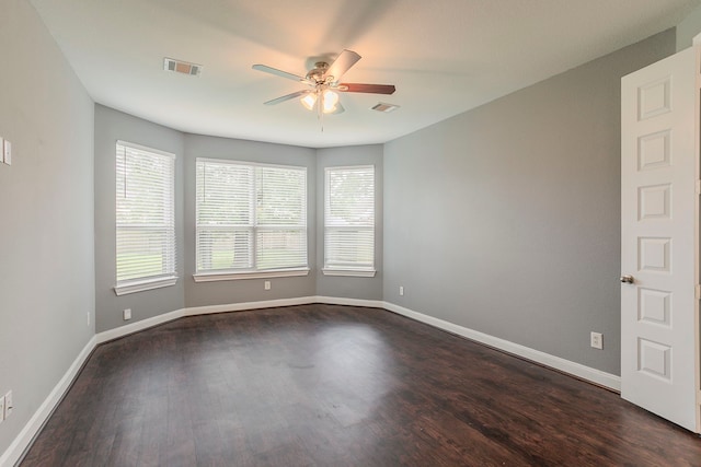 13516 Northline Lake Dr, Houston, TX 77044 - spare room with a ceiling fan, plenty of natural light, dark wood finished floors, and baseboards