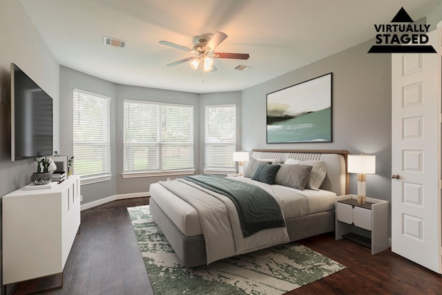 13516 Northline Lake Dr, Houston, TX 77044 - bedroom featuring dark wood-style floors, baseboards, and a ceiling fan