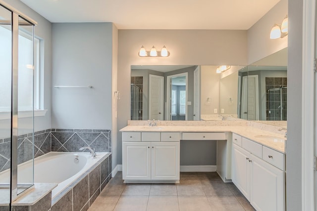 13516 Northline Lake Dr, Houston, TX 77044 - full bathroom featuring double vanity, a garden tub, a shower stall, and tile patterned floors