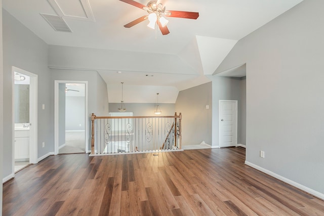 13516 Northline Lake Dr, Houston, TX 77044 - unfurnished room featuring ceiling fan, wood finished floors, attic access, baseboards, and lofted ceiling