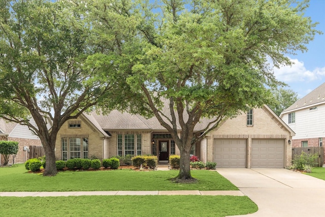 11318 Fawn Springs Ct, Cypress, TX 77433 - view of front of property featuring brick siding, an attached garage, and concrete driveway