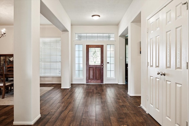 11318 Fawn Springs Ct, Cypress, TX 77433 - foyer entrance featuring baseboards, dark wood-style flooring, a chandelier, and ornamental molding