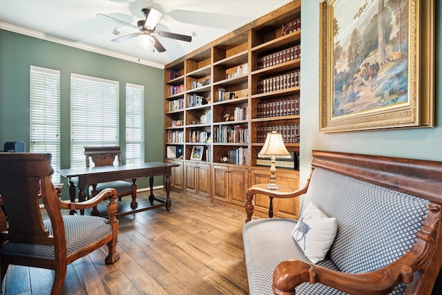 11318 Fawn Springs Ct, Cypress, TX 77433 - office area with crown molding, a ceiling fan, light wood-type flooring, and built in features