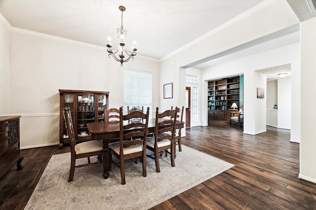 11318 Fawn Springs Ct, Cypress, TX 77433 - dining room with a chandelier, ornamental molding, dark wood-style flooring, baseboards, and built in shelves