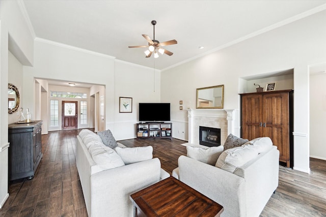 11318 Fawn Springs Ct, Cypress, TX 77433 - living area featuring ceiling fan, crown molding, a tile fireplace, dark wood-style floors, and a high ceiling