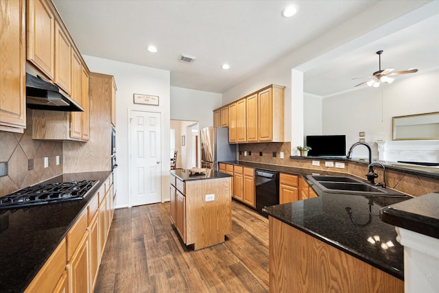 11318 Fawn Springs Ct, Cypress, TX 77433 - kitchen featuring black appliances, a sink, a center island, under cabinet range hood, and dark wood-type flooring