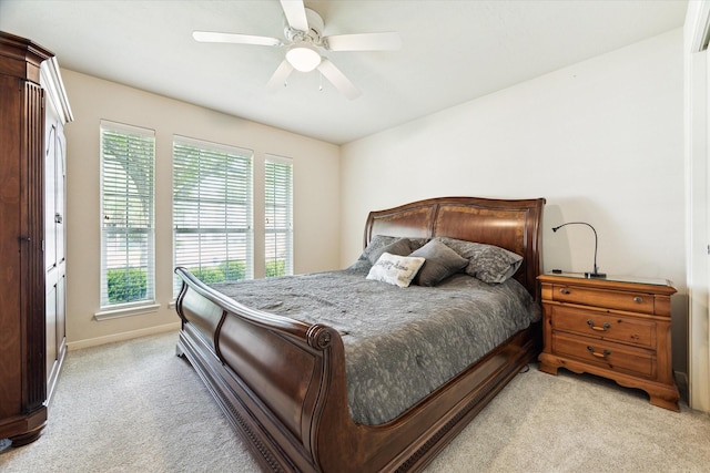 11318 Fawn Springs Ct, Cypress, TX 77433 - bedroom with light carpet, multiple windows, baseboards, and ceiling fan