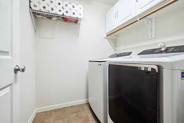 11318 Fawn Springs Ct, Cypress, TX 77433 - laundry area featuring cabinet space, washer and clothes dryer, and baseboards