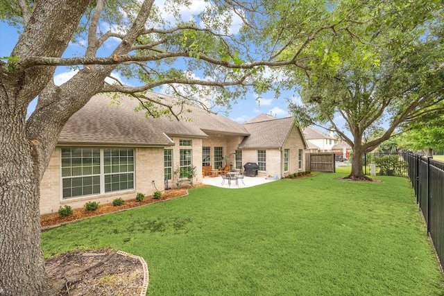 11318 Fawn Springs Ct, Cypress, TX 77433 - rear view of property with a shingled roof, a patio, and brick siding