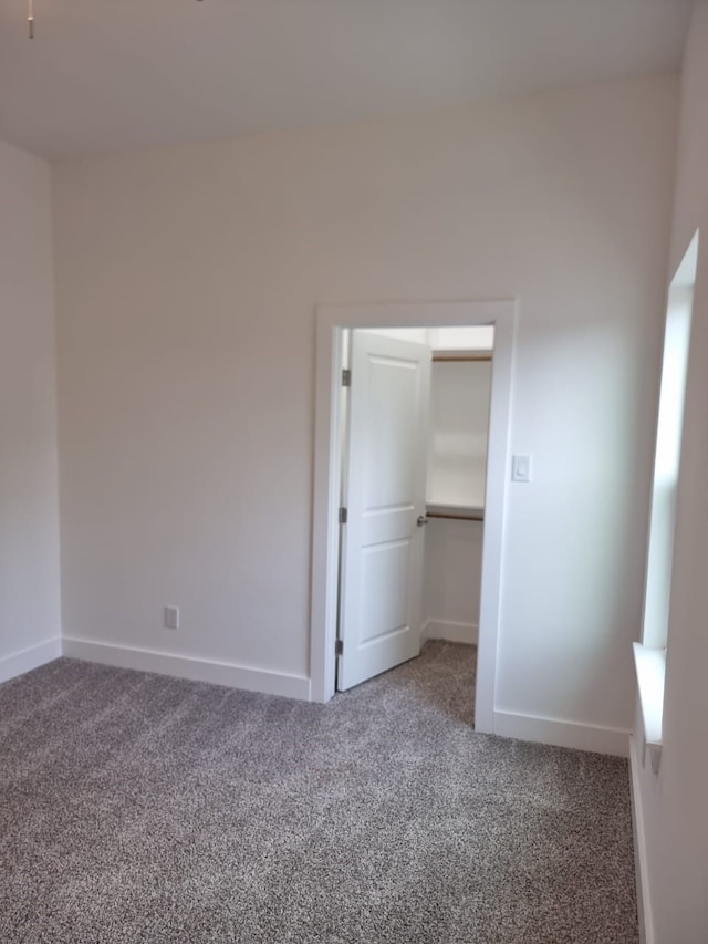 4539 Rosemont St A/B, Unit A/B Houston, TX 77051 - unfurnished bedroom featuring carpet flooring, a spacious closet, and baseboards