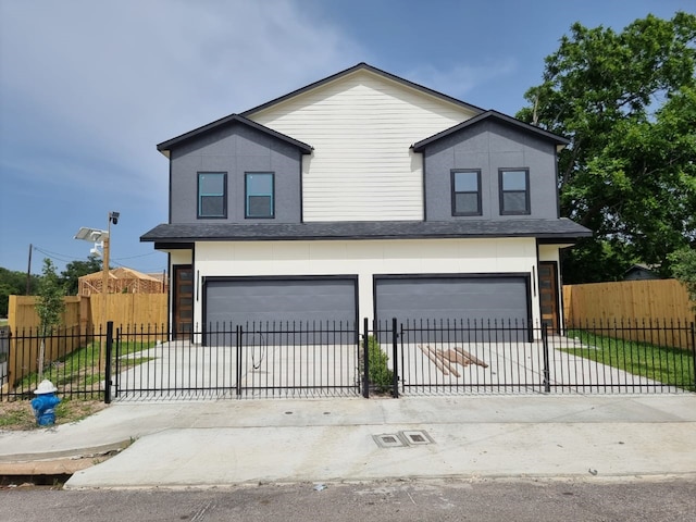 4539 Rosemont St A/B, Unit A/B Houston, TX 77051 - view of front facade featuring a garage, concrete driveway, and stucco siding