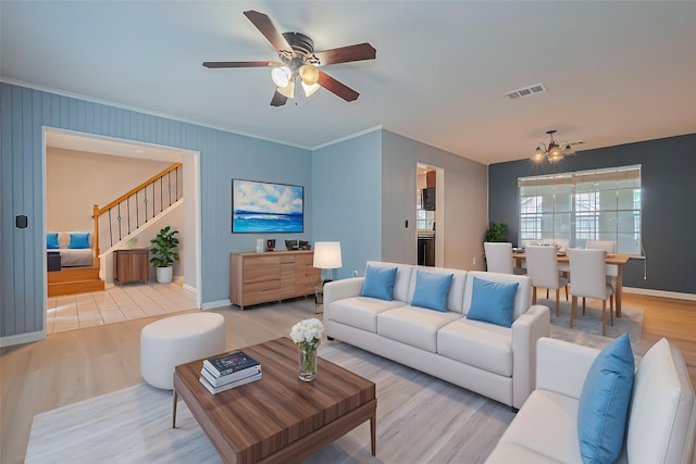 1010 Cheyenne Meadows Dr, Katy, TX 77450 - living room featuring wood finished floors, stairs, ornamental molding, a ceiling fan, and baseboards