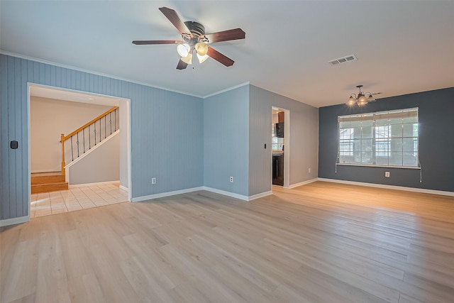 1010 Cheyenne Meadows Dr, Katy, TX 77450 - unfurnished room with crown molding, stairway, wood finished floors, ceiling fan, and baseboards