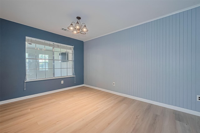 1010 Cheyenne Meadows Dr, Katy, TX 77450 - empty room featuring a chandelier, wood finished floors, baseboards, and crown molding
