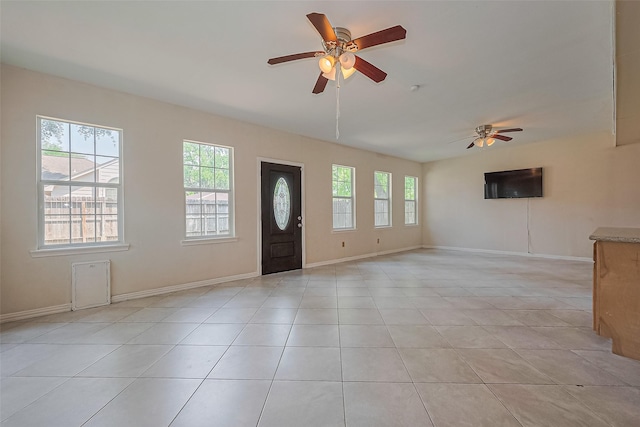 1010 Cheyenne Meadows Dr, Katy, TX 77450 - entrance foyer with ceiling fan, light tile patterned flooring, baseboards, and vaulted ceiling
