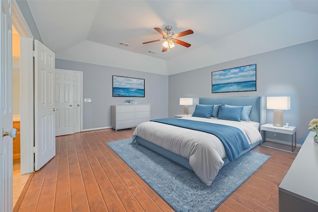 1010 Cheyenne Meadows Dr, Katy, TX 77450 - bedroom featuring light wood-style flooring, vaulted ceiling, a ceiling fan, and baseboards
