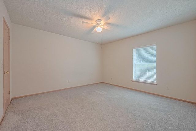 1010 Cheyenne Meadows Dr, Katy, TX 77450 - unfurnished room featuring light carpet, a ceiling fan, a textured ceiling, and baseboards