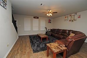 4619 Ehrlich Ct, Rosenberg, TX 77471 - living room featuring a ceiling fan, wood finished floors, and baseboards