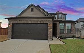 4619 Ehrlich Ct, Rosenberg, TX 77471 - view of front of property featuring driveway, a garage, and brick siding